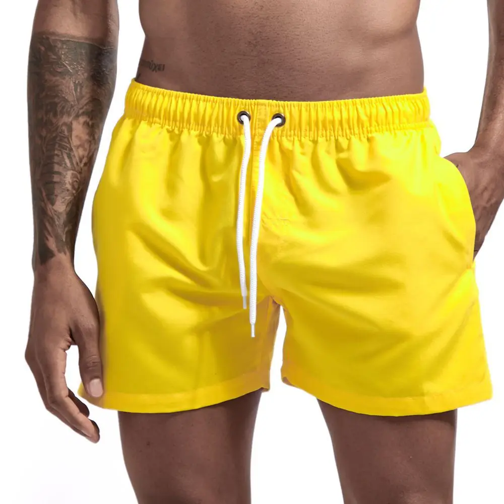 זכר מכנסיים קצרים אופנה כיס מוצק צבע מכנסיים קצרים Mens הקיץ כושר יבש מהירה בגדי חוף מנהל Breechcloth ישבנים - 0